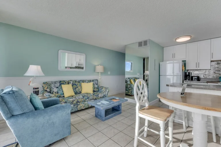 Bright living room and kitchen area inside The Green Starfish oceanfront condo